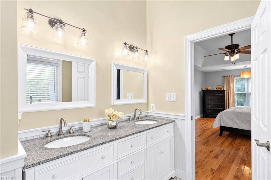 Primary bath features a double vanity and generous counter space