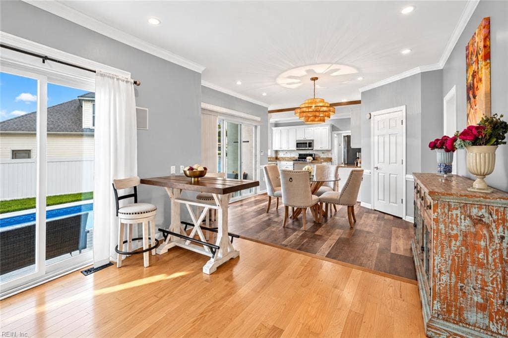 Open-concept layout connects the kitchen, dining and living spaces