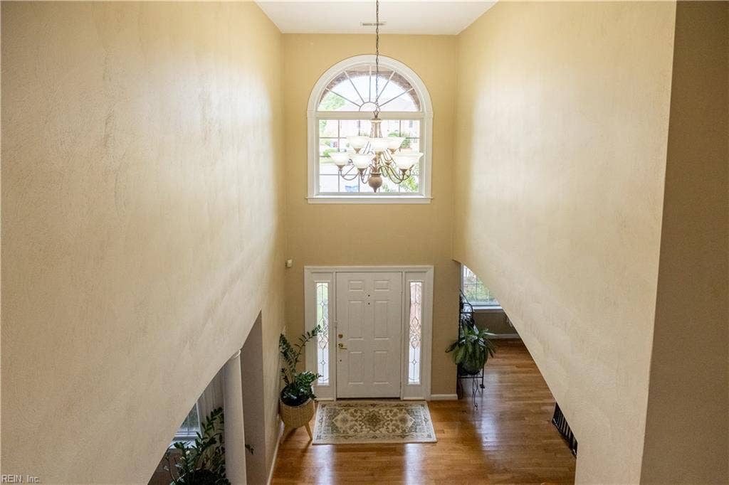 view of 2 story foyer from upstairs hall