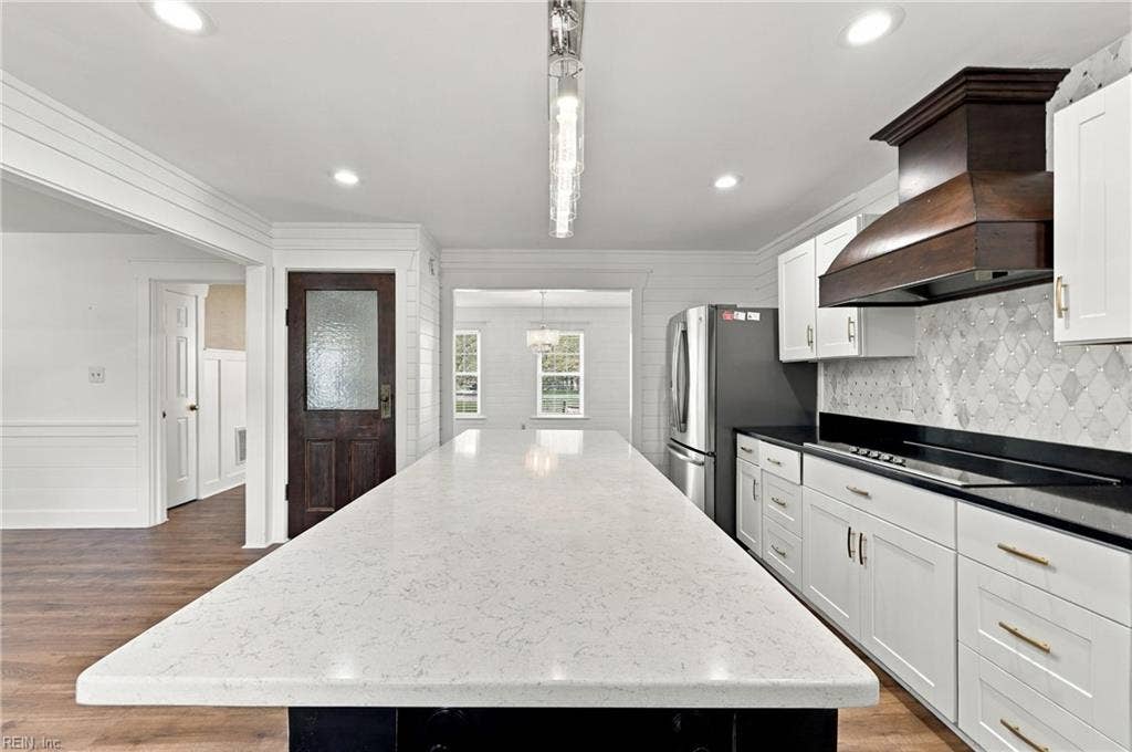 Updated kitchen with custom island and quartz countertops