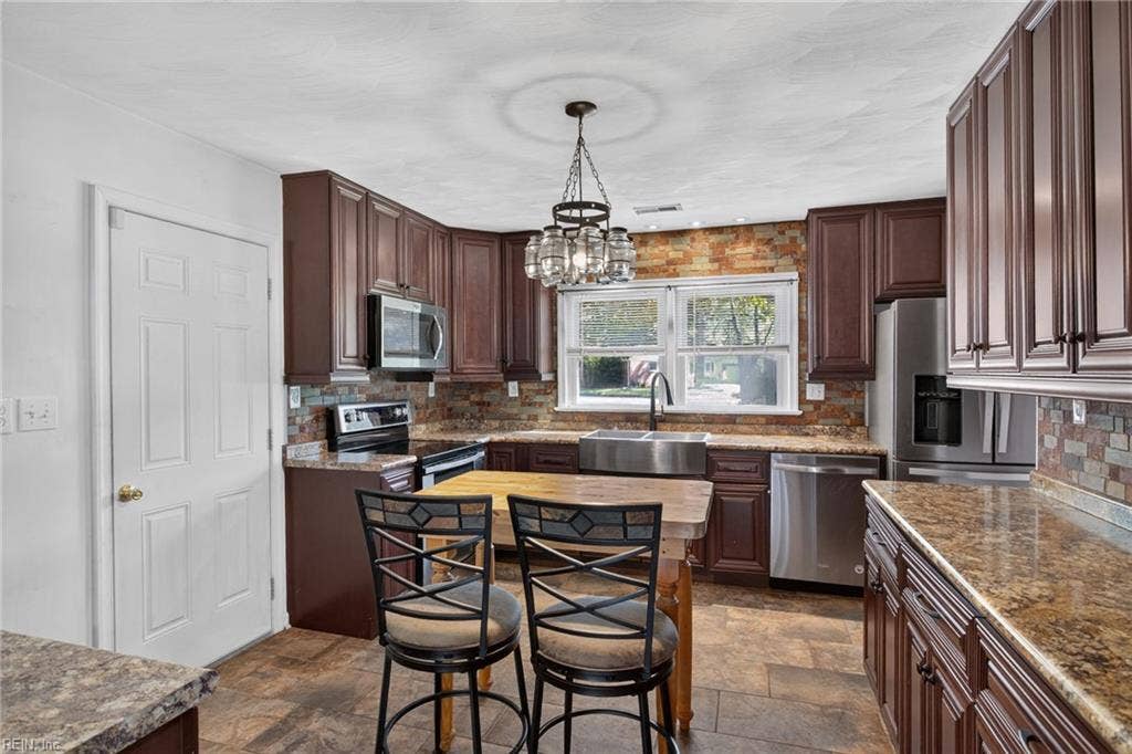 Plenty of Cabinets and Countertops in this Beautiful Kitchen