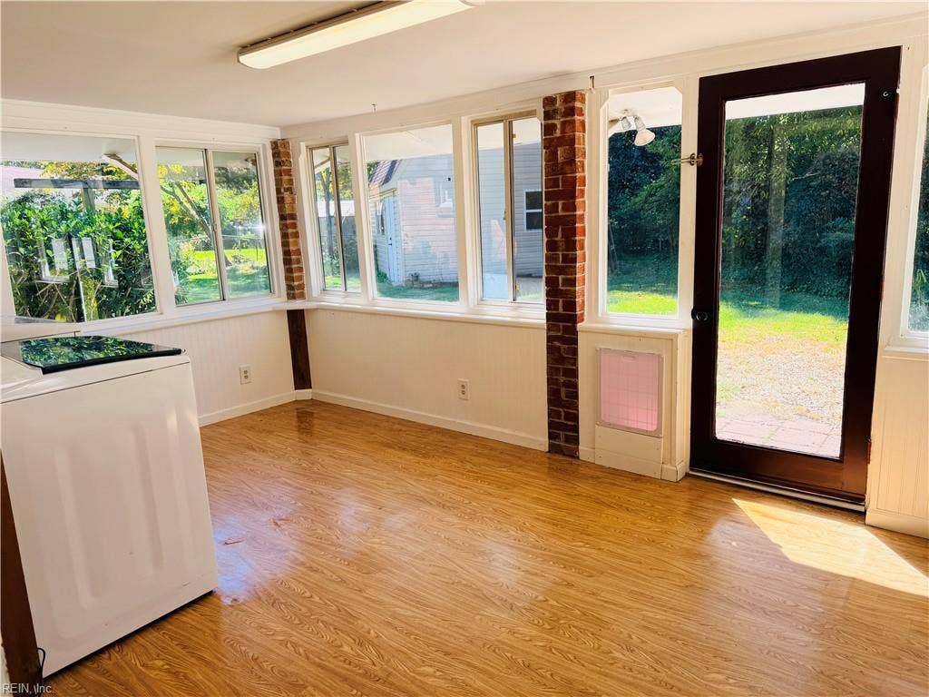 Sunroom/Utility with access to fenced backyard