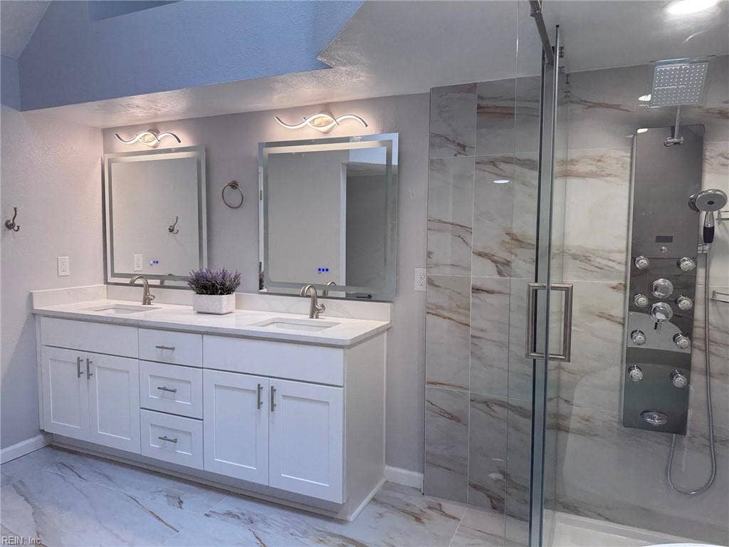 3024 Red Maple Lane, Lynnhaven Woods, Virginia Beach, VA 23452 Primary bathroom with double vanities, lighted mirrors, walk-in shower