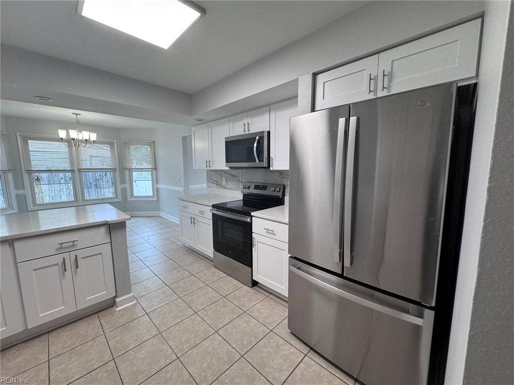 3024 Red Maple Lane, Lynnhaven Woods, Virginia Beach, VA 23452 Kitchen showing range and French door refrigerator