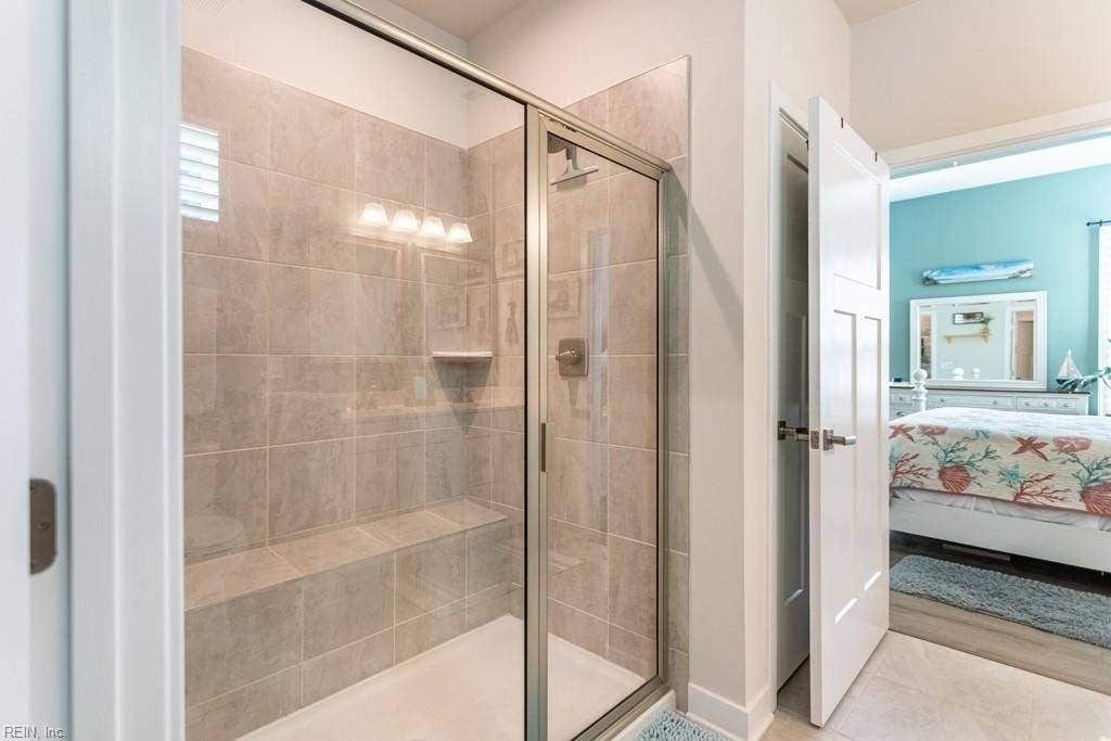 Primary bathroom shower with bench