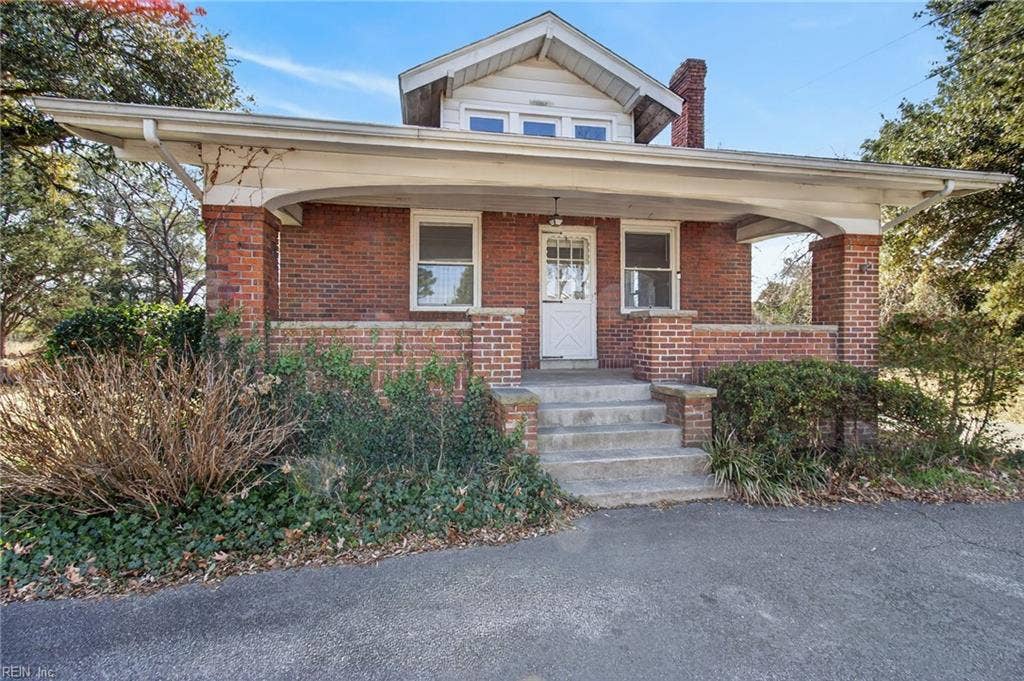 Prominent front porch is inviting and provides view of surrounding neighborhood