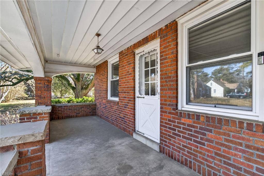 Spacious front porch suitable for gathering and entertaining