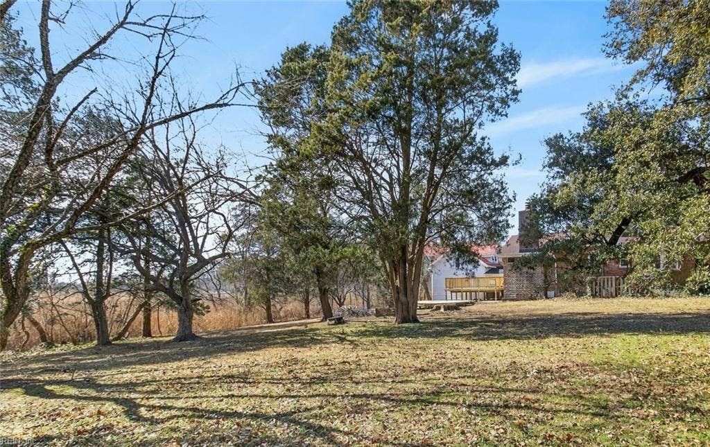 View of large backyard extending along Broad Ck