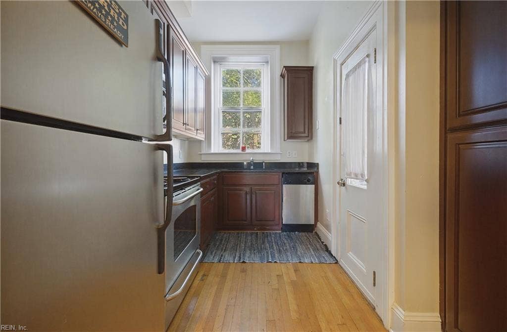 Back door leads to basement with extra storage