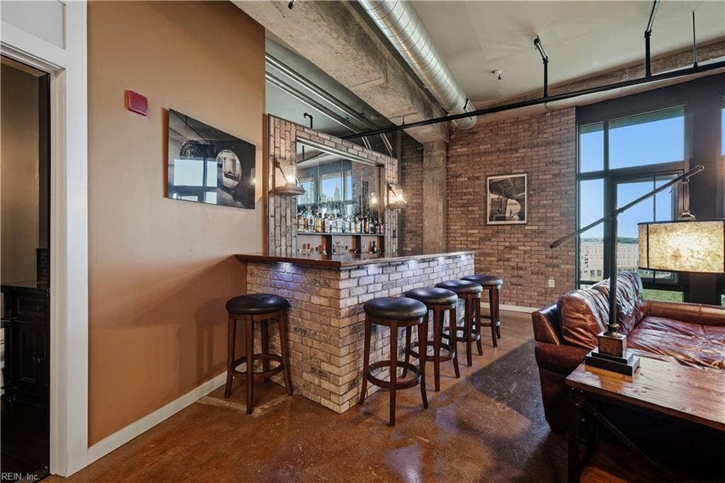 Your own Bar of Black Walnut with brick accents, under lighting and Pendant Lighting