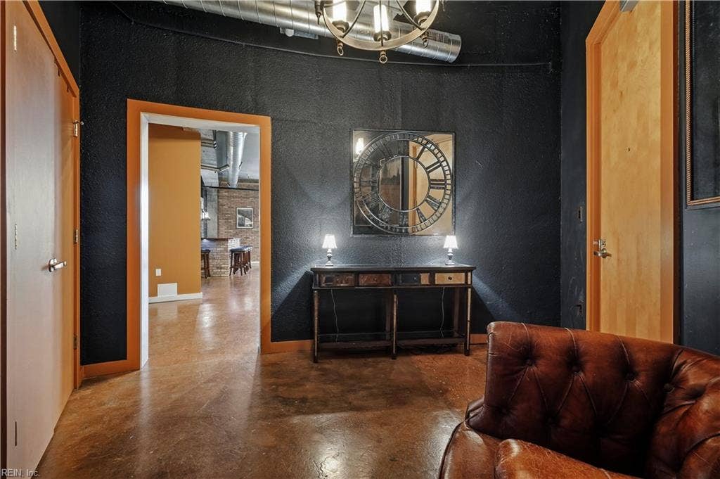 Welcome to this Dramatic and Stunning Efficiency Condo! Solid wood doors, gleaming, polished concrete flooring, exposed ductwork and sprinkler system
