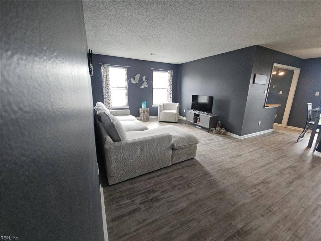 Spacious Laminate Living room opens to the dining room