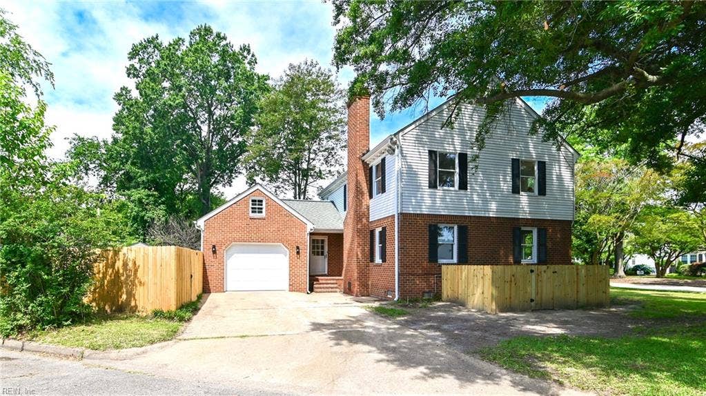 Spacious driveway and huge attached garage.