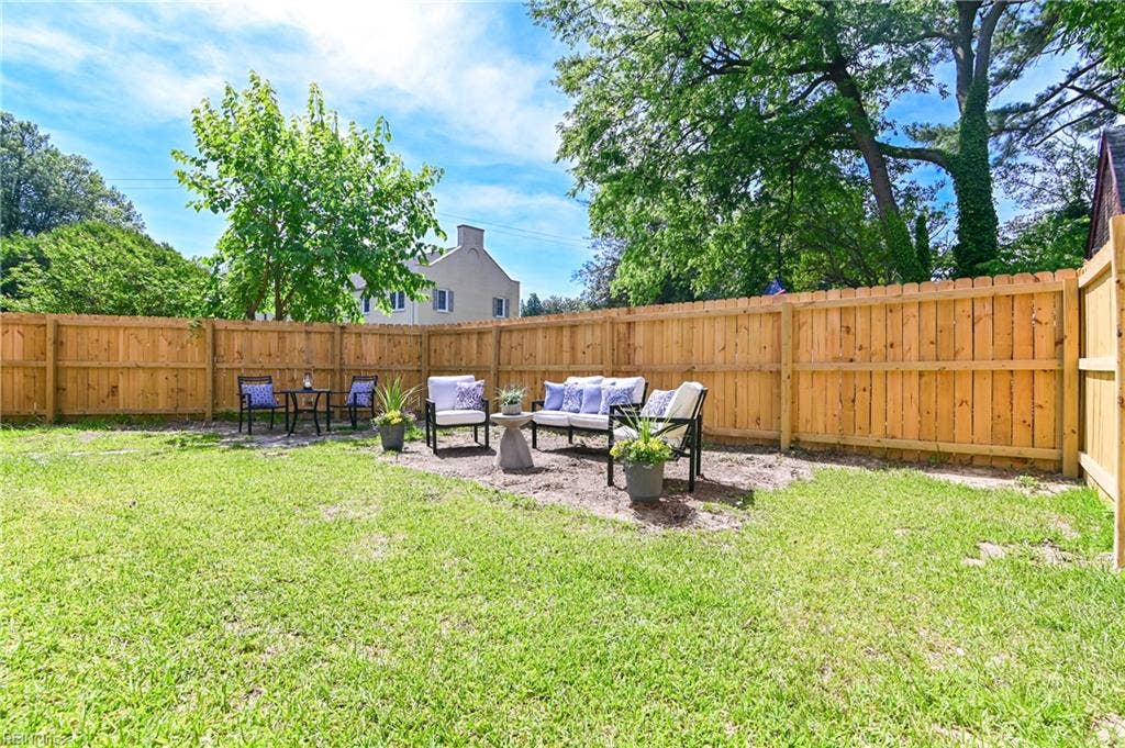Large backyard with new privacy fence.