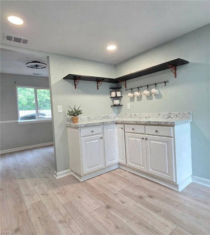 Coffee bar nook with open shelving — slow Saturday mornings start here. Virtually staged