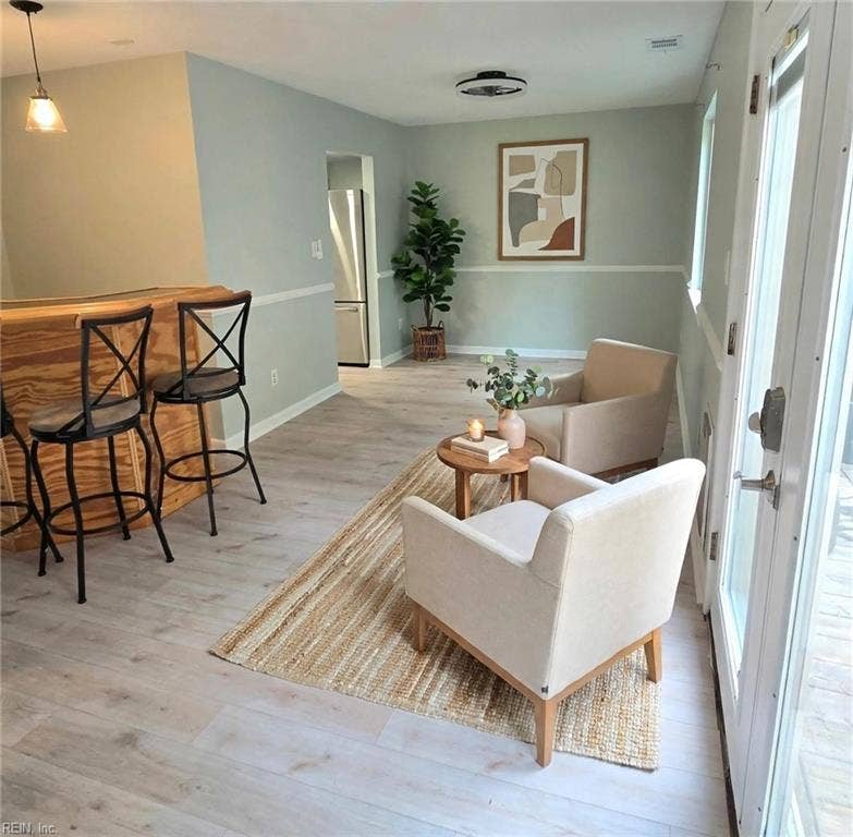 Dining area open to the kitchen — room for the whole crew. Virtually staged