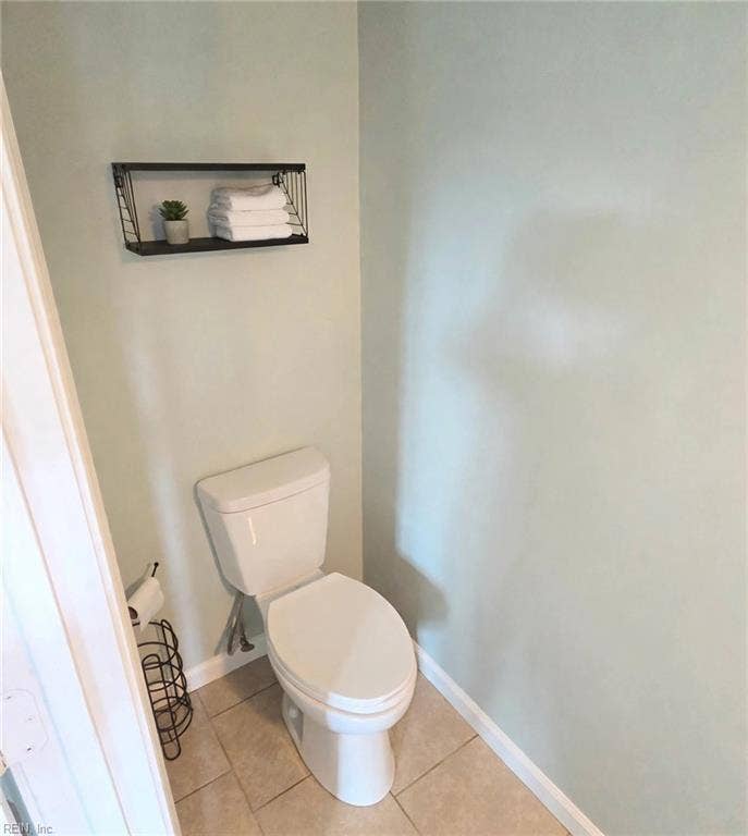 Handy first-floor half bath with updated vanity. Virtually staged