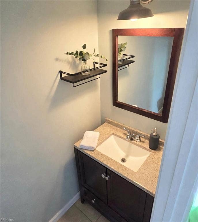 Handy first-floor half bath with updated vanity. Virtually staged