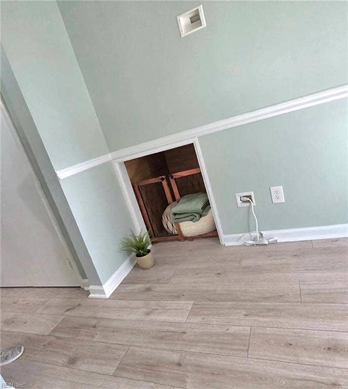 The cutest under-stairs pet nook — your furry family gets a room too! Virtually staged.