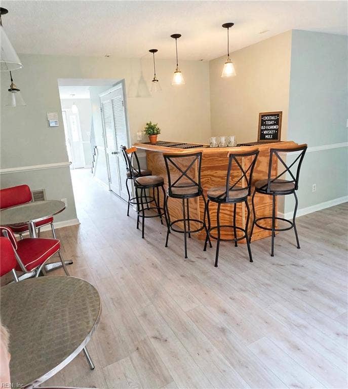Dining area open to the Living area — room for the whole crew. Virtually staged