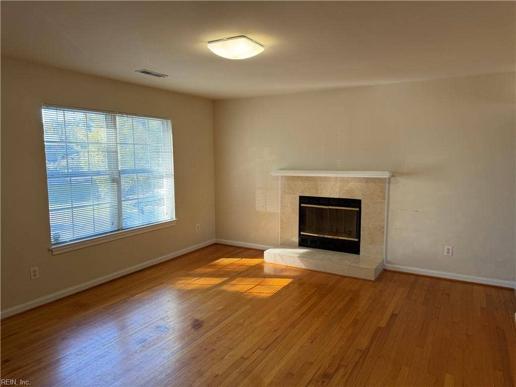 2164 Pungo Ferry Road, Pungo, Virginia Beach, VA 23457 Living Room with hardwood floors & wood burning fireplace