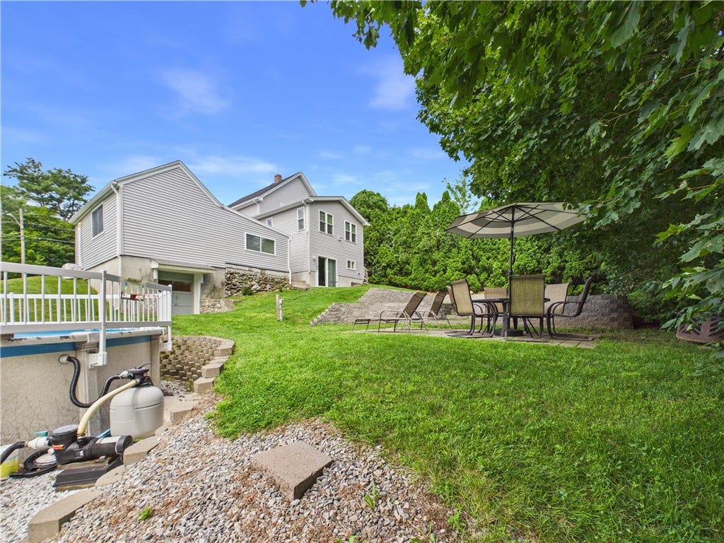 36 Bellevue Avenue, North Smithfield, RI 02896 Backyard with above-ground pool at this North Smithfield home, situated on an approximately 14,941-square-foot lot.