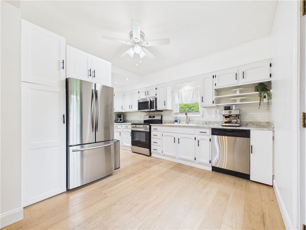 36 Bellevue Avenue, North Smithfield, RI 02896 Kitchen view from the dining room at 36 Bellevue Avenue, showcasing a functional layout with an easy connection to the homes dining and entertaining spaces.