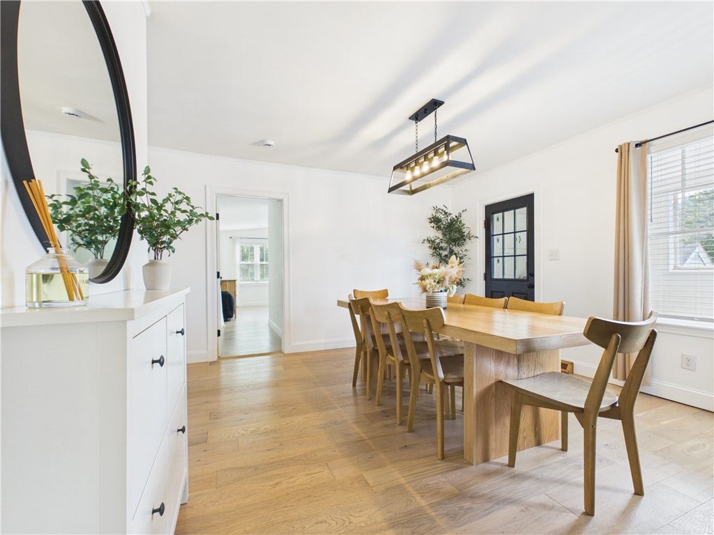 36 Bellevue Avenue, North Smithfield, RI 02896 View from the hallway into the dining room at 36 Bellevue Avenue, showcasing a dedicated space for everyday meals, entertaining, and gathering with family and friends.