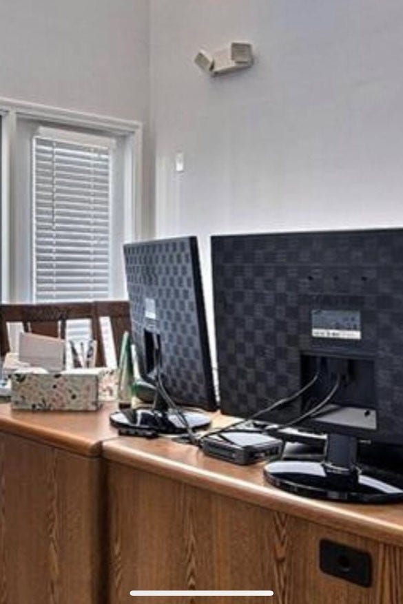 Image taken with previous tenants furniture.  Entry room/reception area.