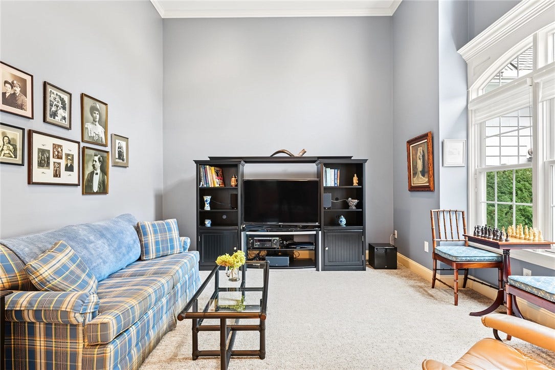 95 Fry Brook Drive, East Greenwich, RI 02818 An intimate and inviting retreat with a lovely connection to the adjoining spaces.