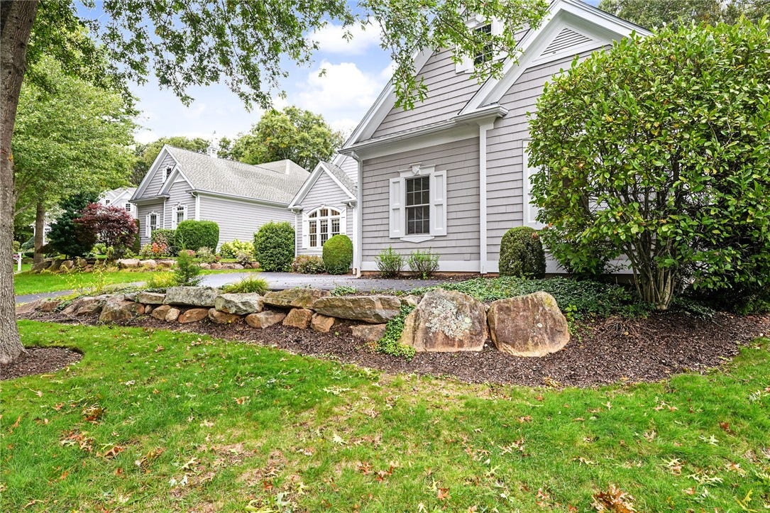 95 Fry Brook Drive, East Greenwich, RI 02818 Beautifully landscaped grounds and a sweeping driveway complement the home's sophisticated exterior.