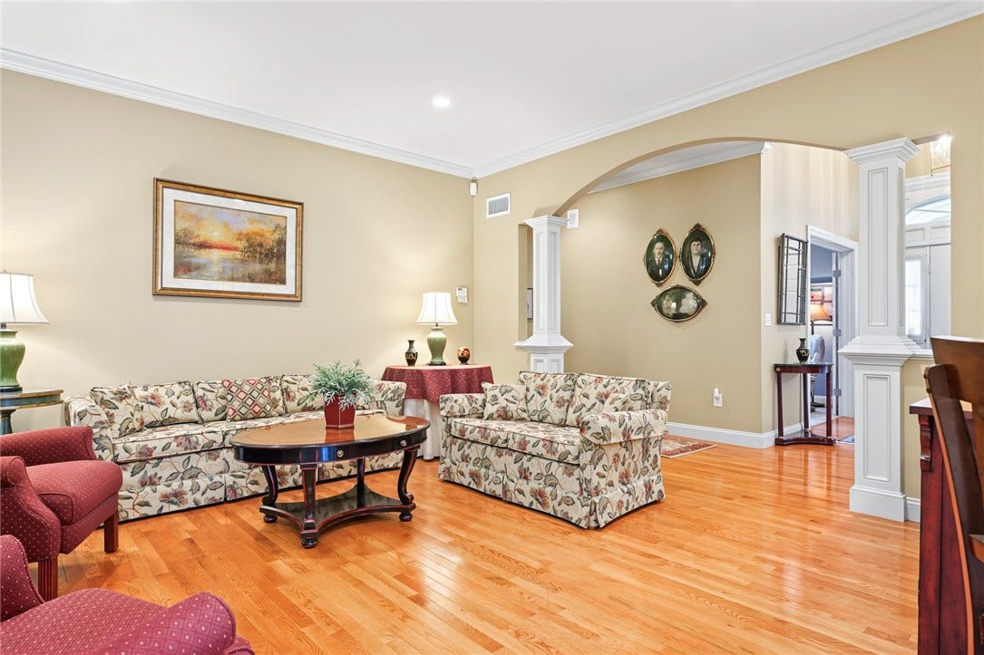 95 Fry Brook Drive, East Greenwich, RI 02818 Graceful architectural columns and archways that create an elegant transition to the adjoining living spaces.