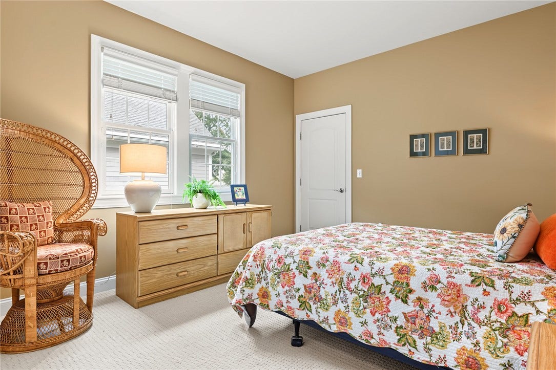95 Fry Brook Drive, East Greenwich, RI 02818 A spacious and inviting second ensuite bedroom features high ceilings, generous proportions and oversized closet.