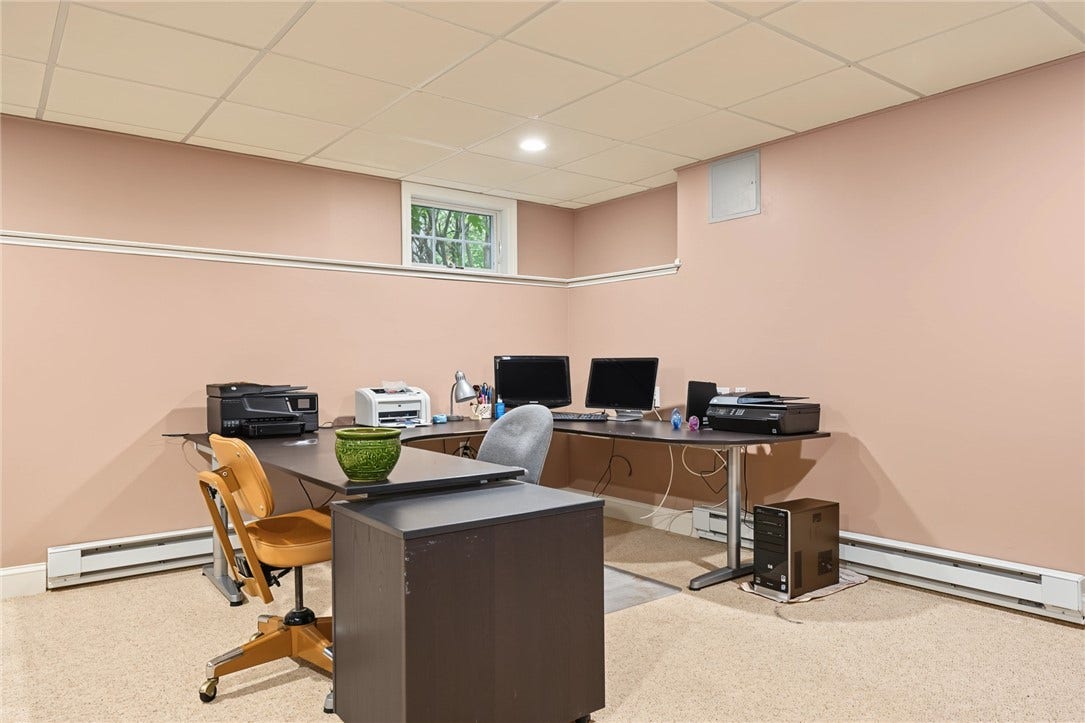 95 Fry Brook Drive, East Greenwich, RI 02818 This lower-level home office offers a quiet, dedicated workspace ideal for today's work-from-home lifestyle.