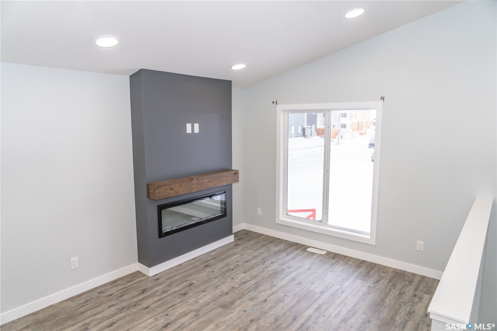 318 Stehwien Street, Saskatoon SK S7W 1H5 FIREPLACE IS OPTIONAL UPGRADE. wood-style floors and lofted ceiling PRICE