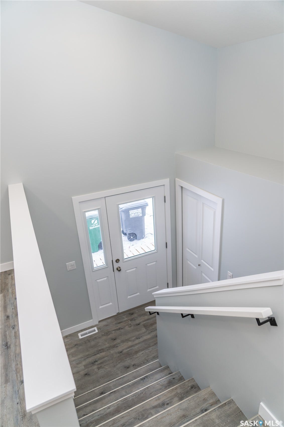 318 Stehwien Street, Saskatoon SK S7W 1H5 Entrance foyer featuring dark wood-type flooring