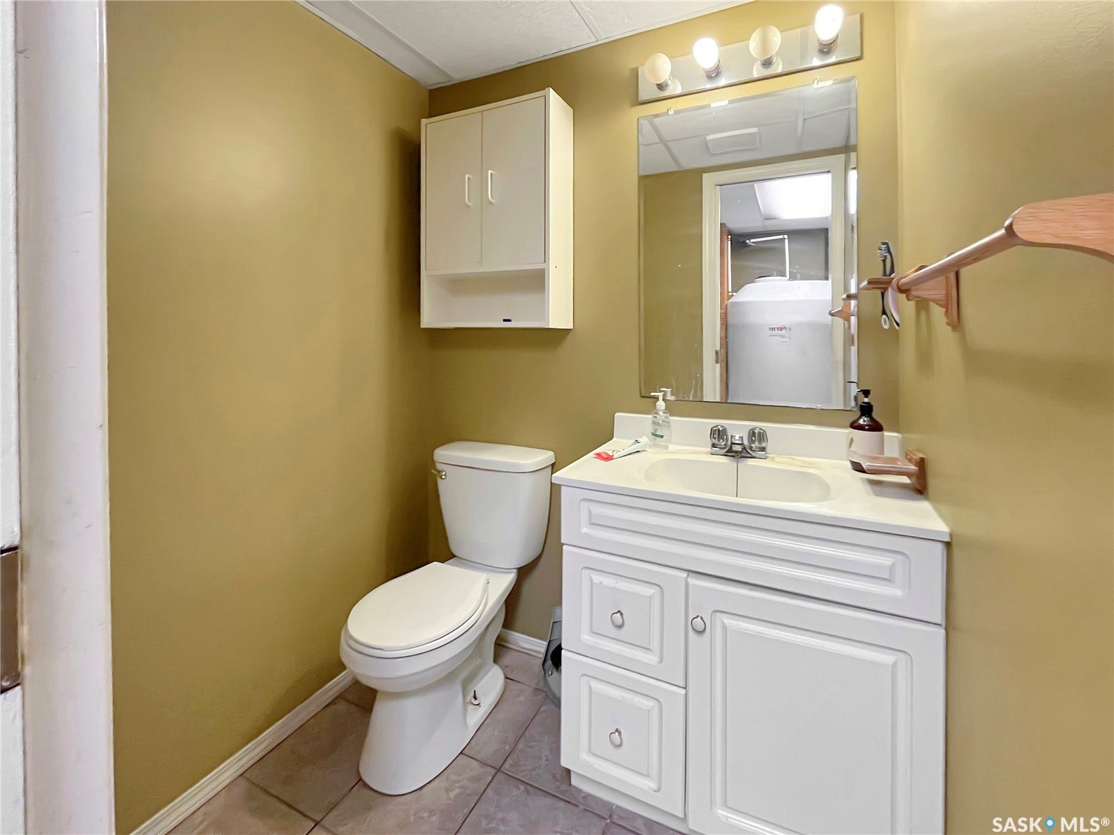 White vanity with an integrated sink and chrome fixtures