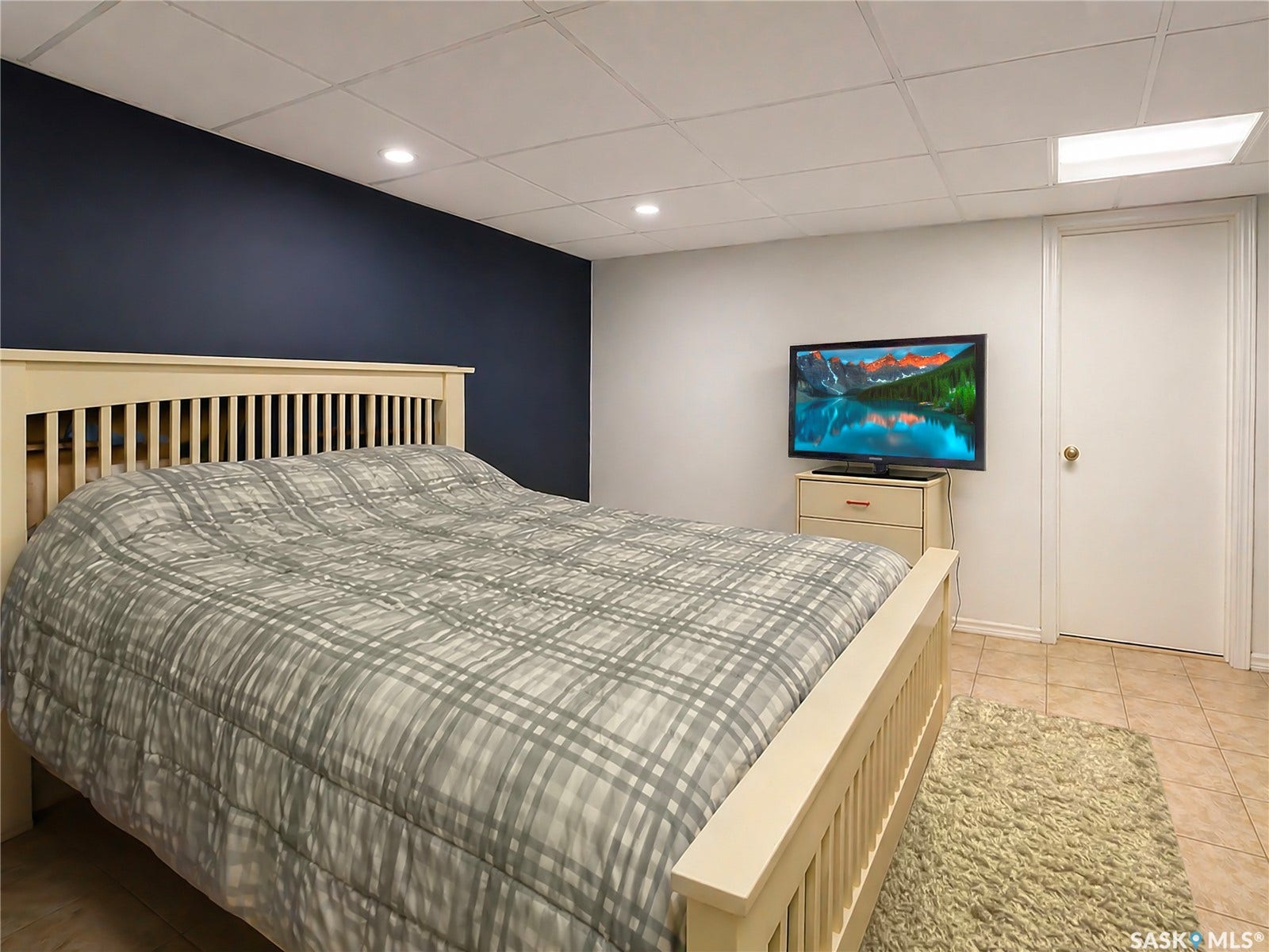 Recessed lighting, drop ceiling, accent wall, tile flooring, with a private entrance
