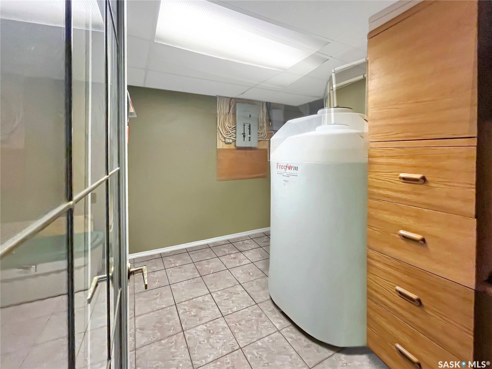 Hallway leading to the basement bathroom and private entrance room