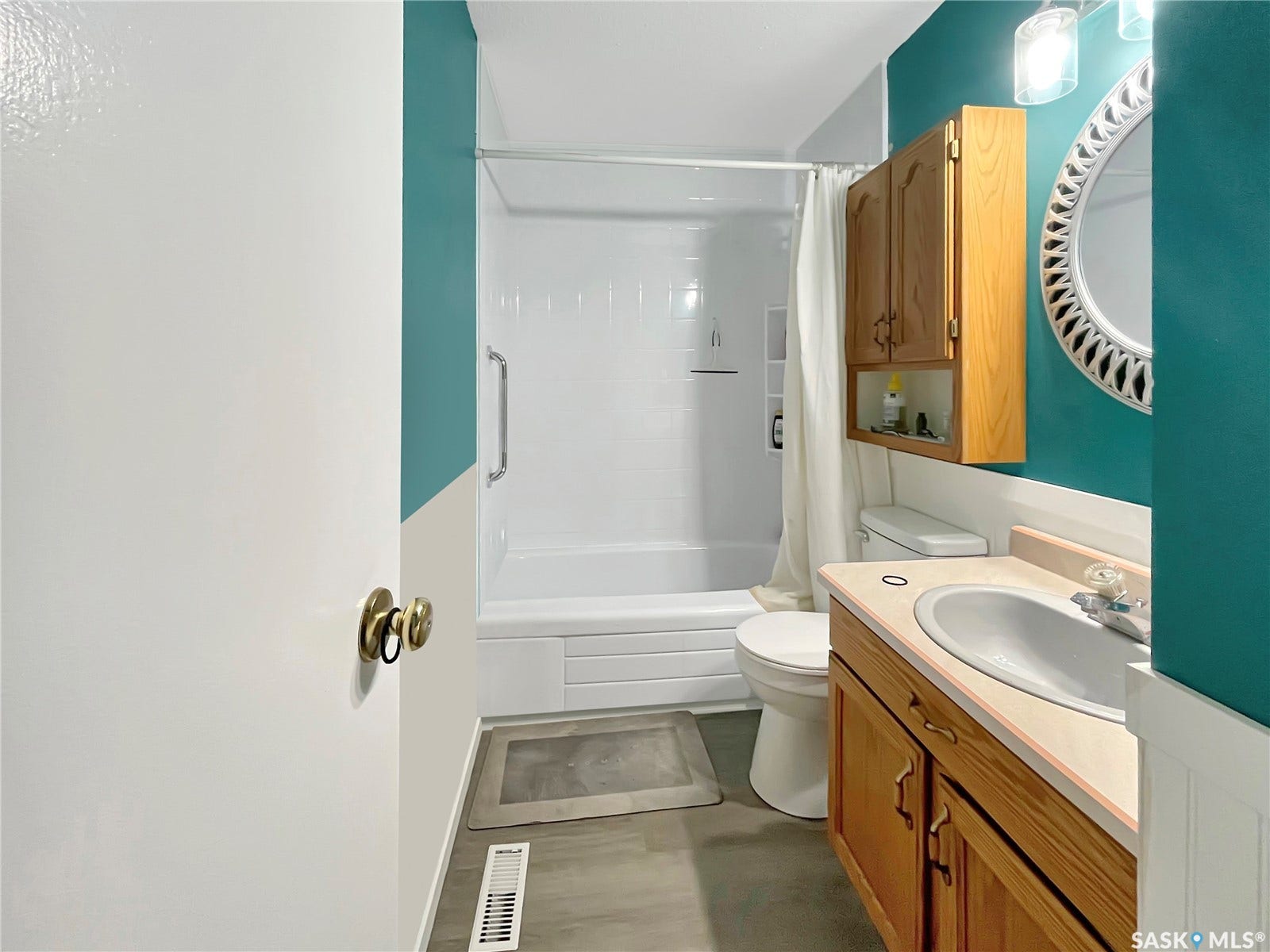 Built-in vanity with under-sink storage, a single basin, and wood-finish cabinetry