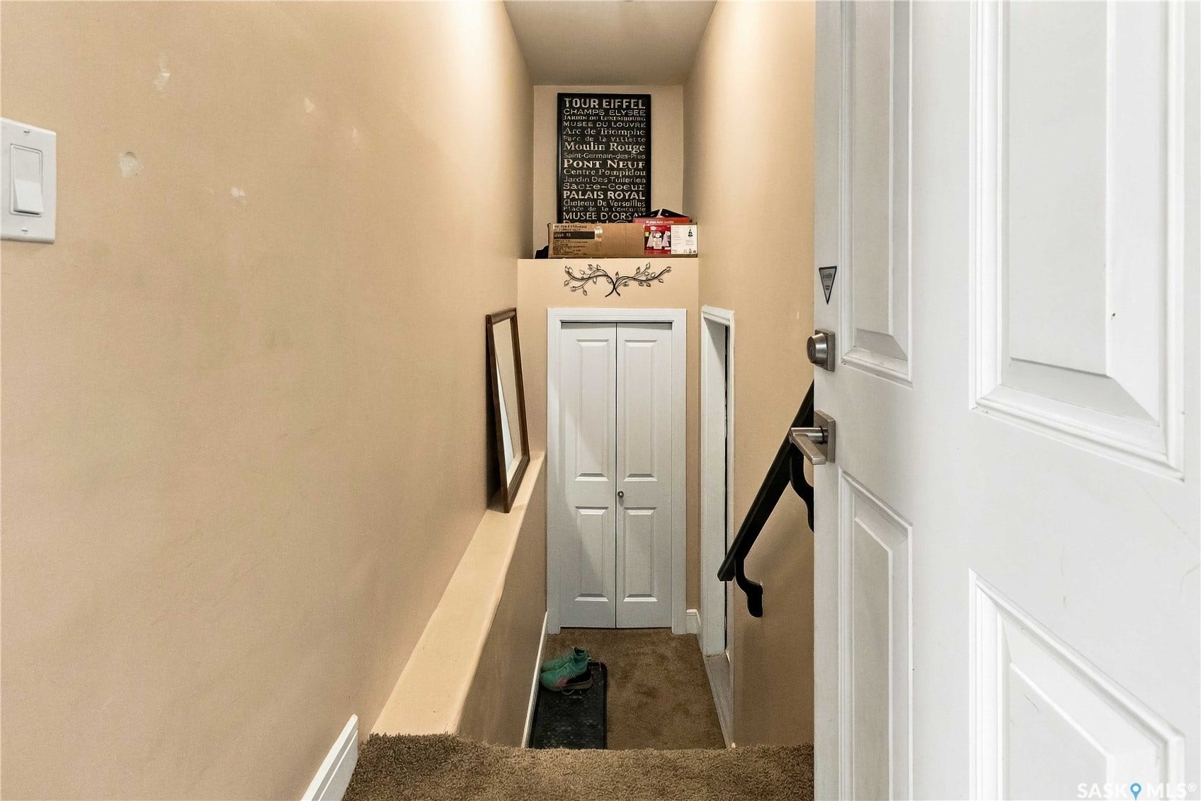 White paneled door with contemporary hardware