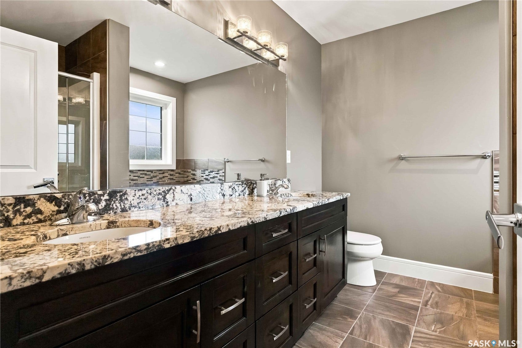 Dual vanity with undermount sinks and stone countertops