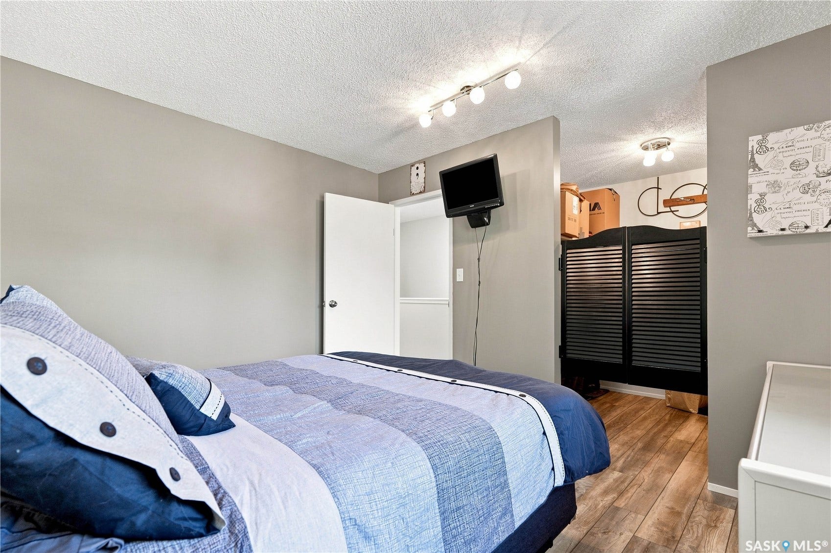 Track lighting illuminates the ceiling