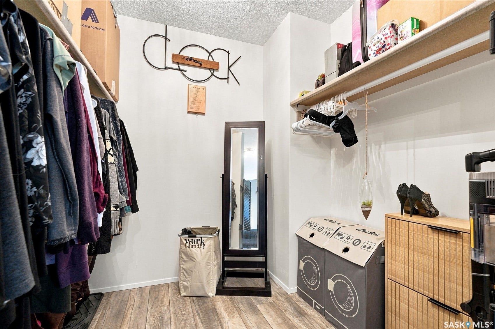 Built-in shelving, wood-finish flooring, and white walls