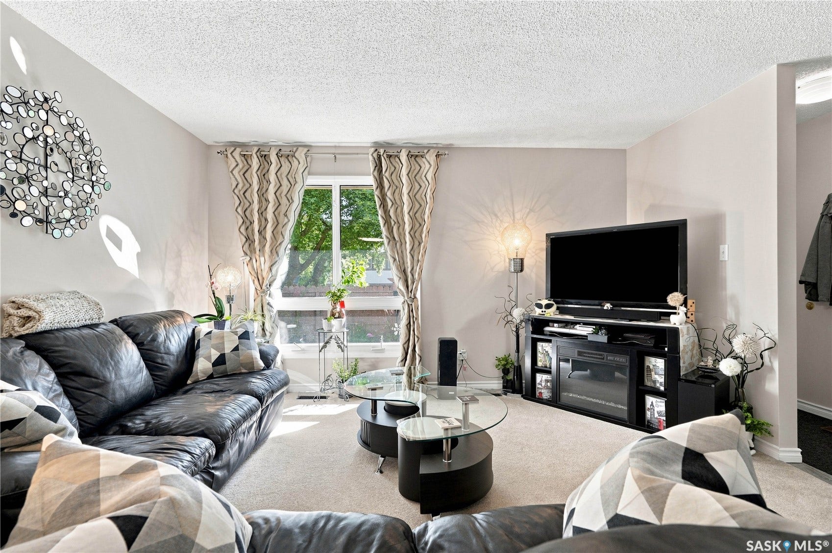 Soft neutral wall color, white trim, and light-toned carpet flooring