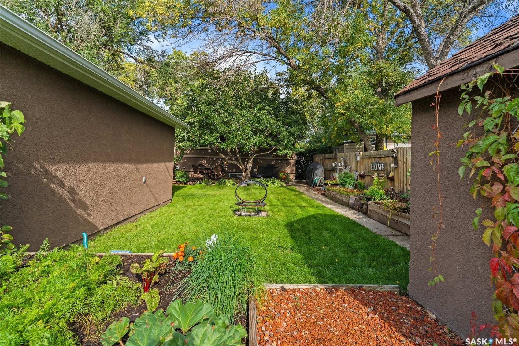 view of back of home from garden bed in back yard
