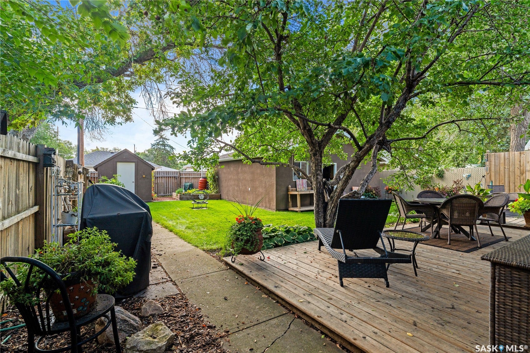 back deck with sitting area and out to spacious yard.