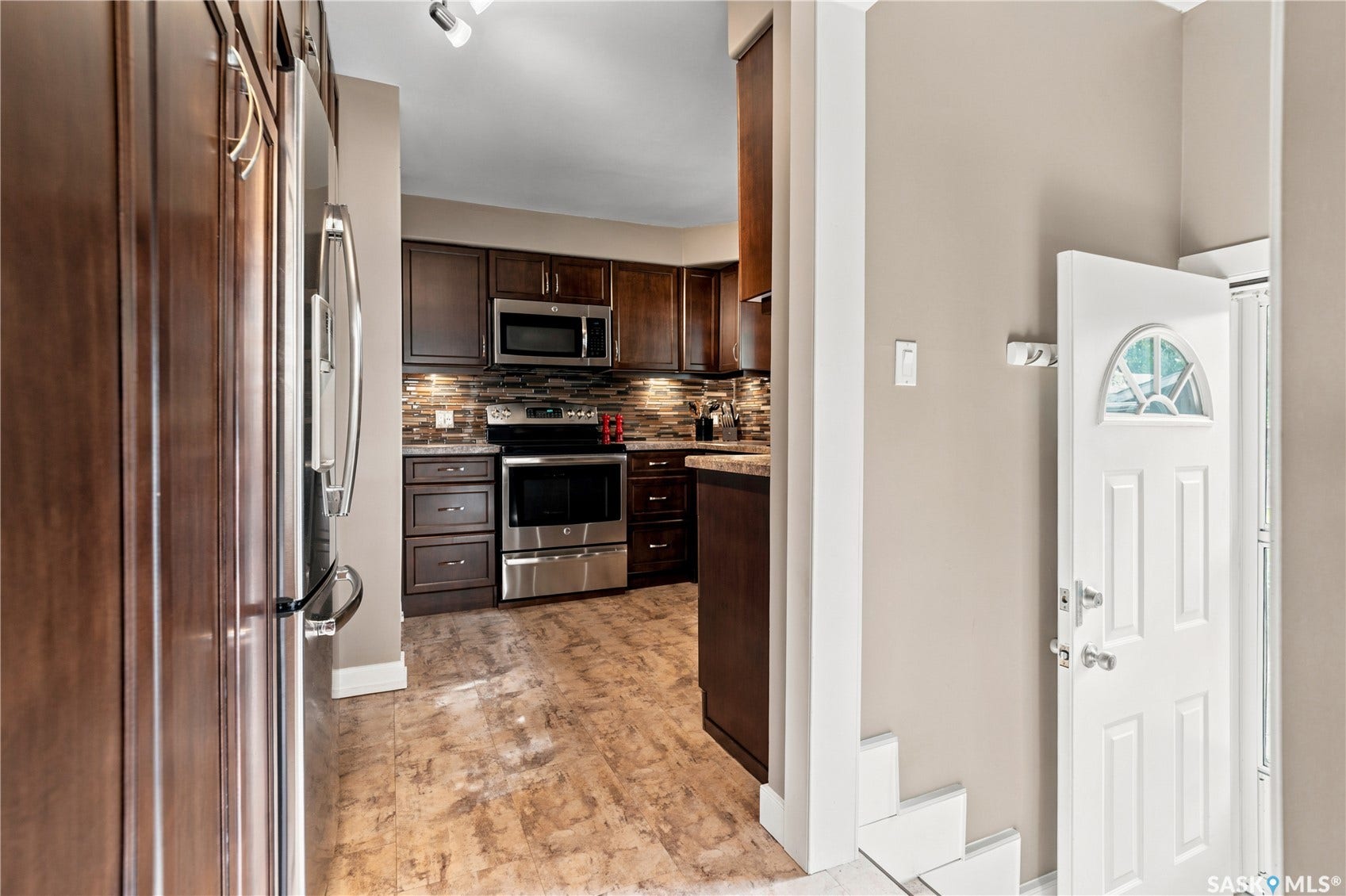 kitchen cabinets with stairs to back door