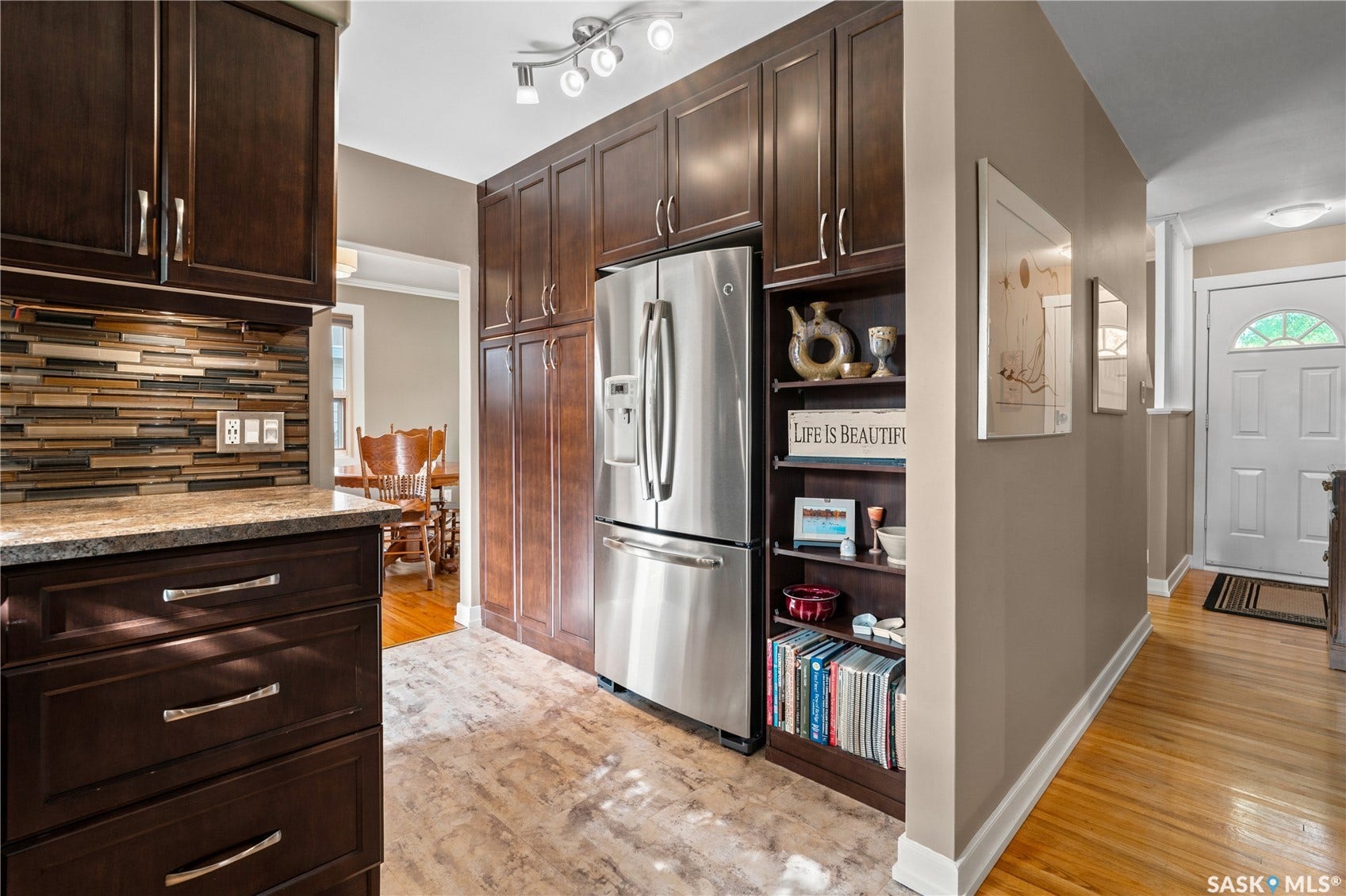 kitchen with dark cabinets and stainless steel appliances.
