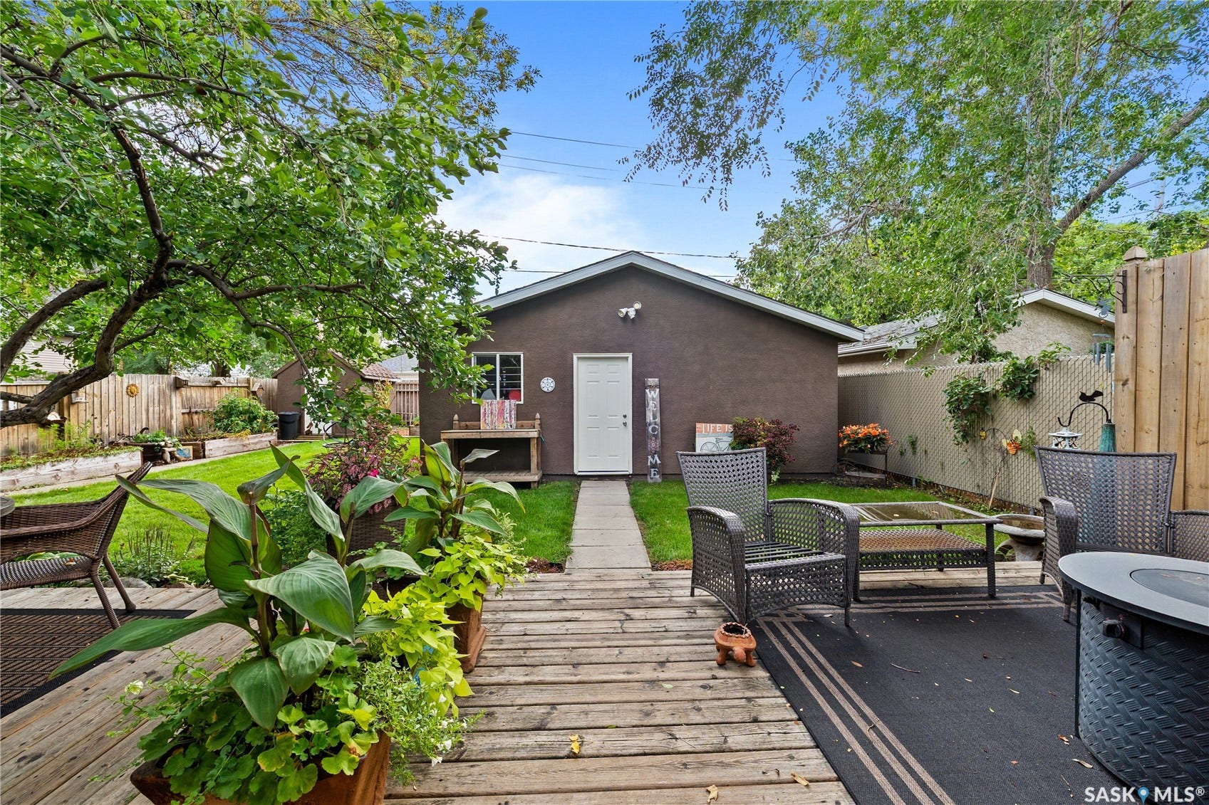 back deck leading out to the yard and double detached garage